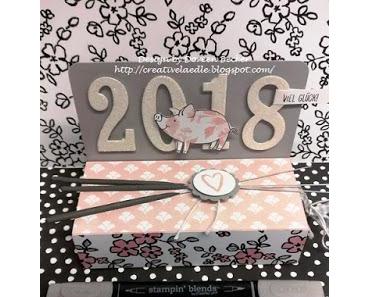 Neujahrs-GlücksSchweinchen-Verpackung und Grüße